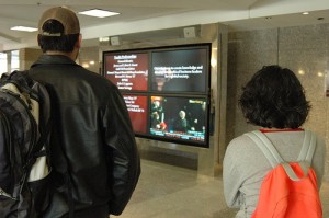 Students at work watch the inauguration
