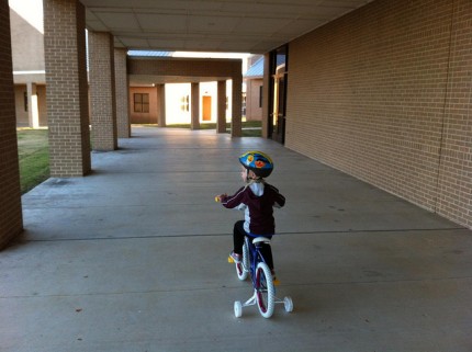 She enjoys the breeze in her helmeted hair