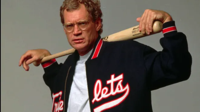 Publicity photo of Letterman posing with a baseball bat