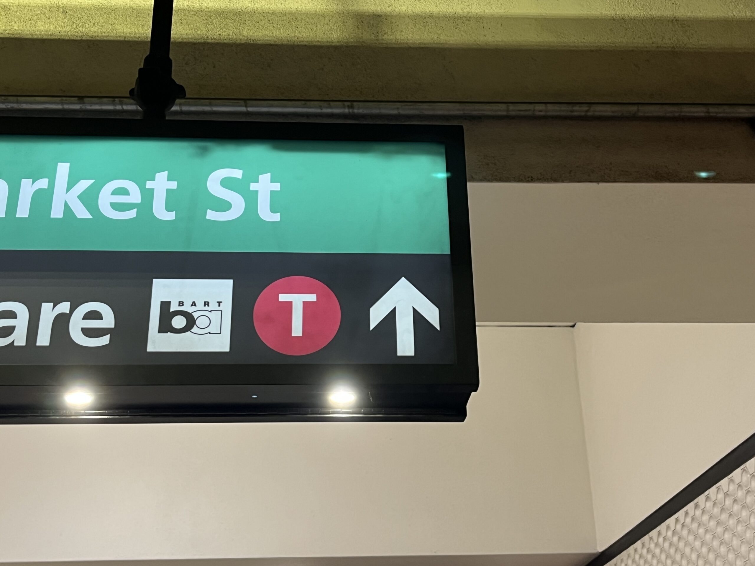 White up arrow on a wayfinding sign