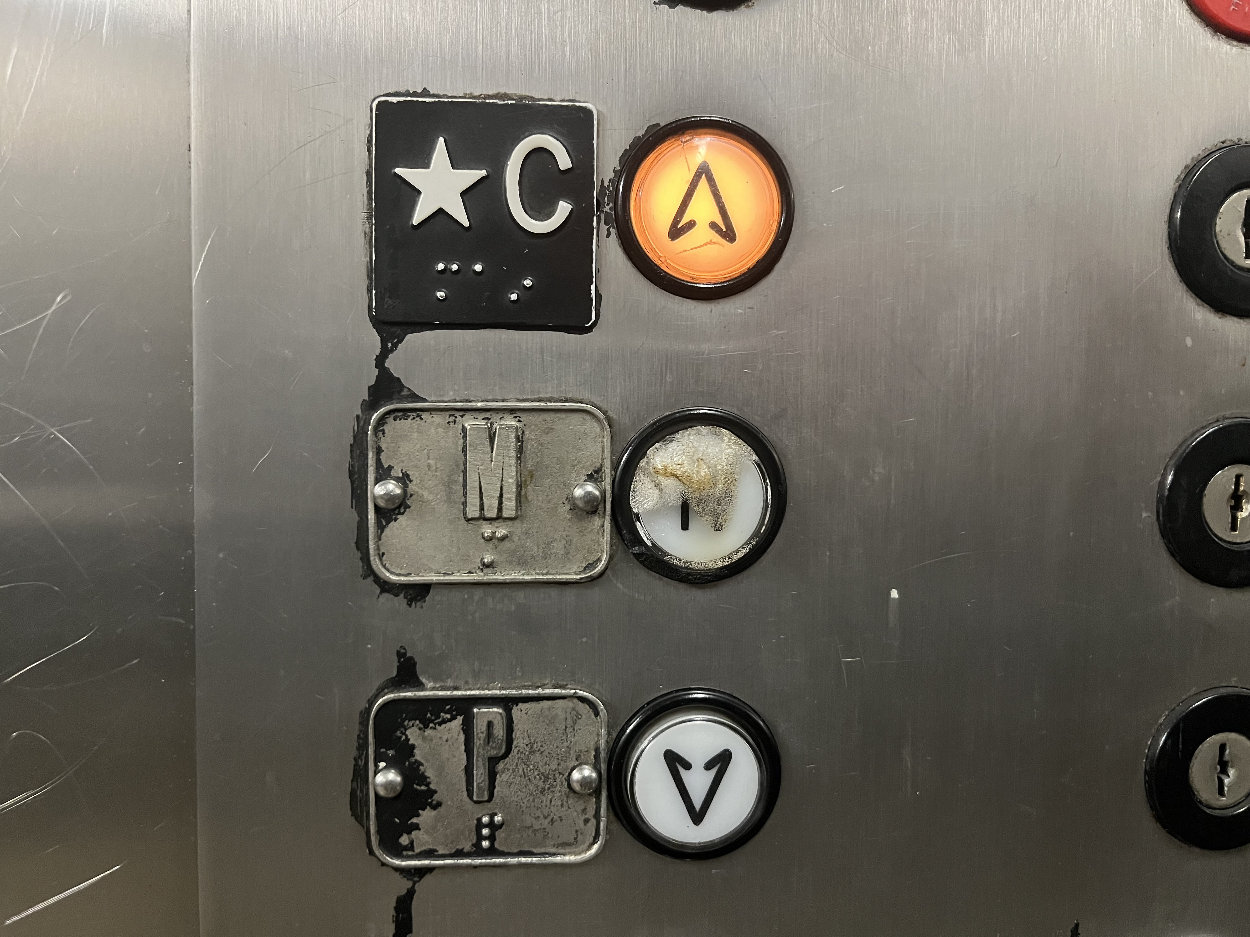 Arrows on elevator buttons