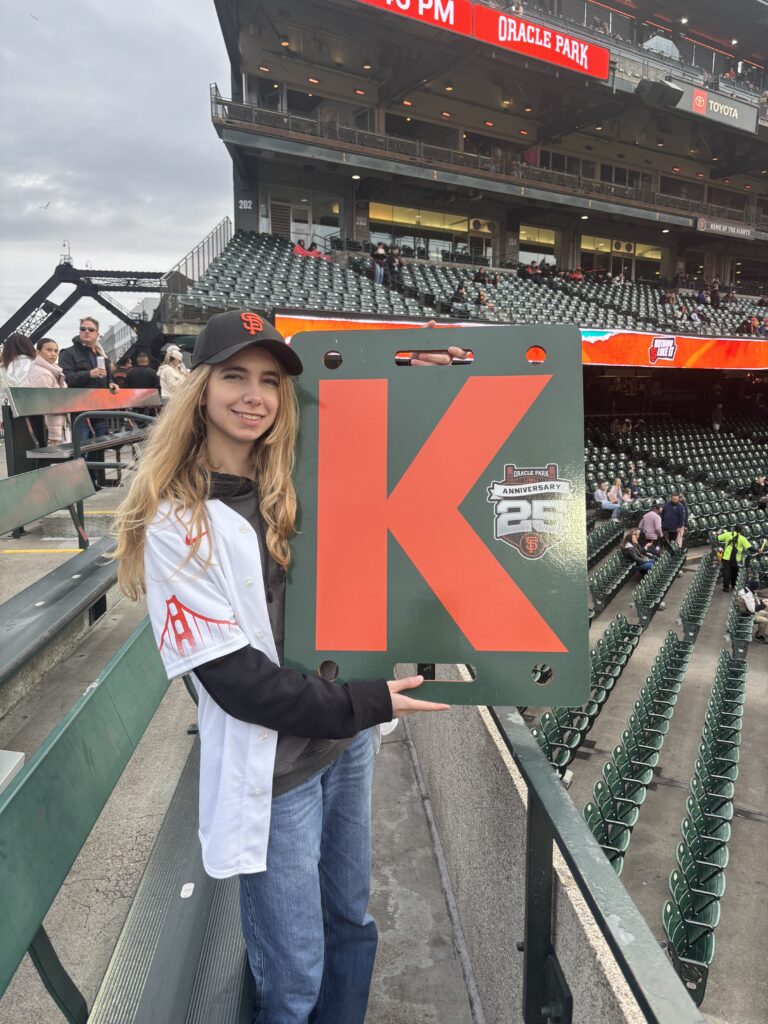 The Daughter holding a K sign